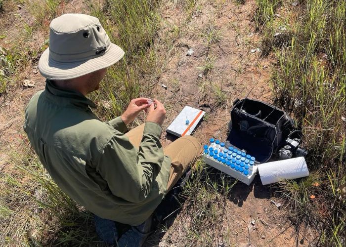 Thilo collects samples from ’Sundew Springs' at Charnley River–Artesian Range Wildlife Sanctuary in the Kimberley.